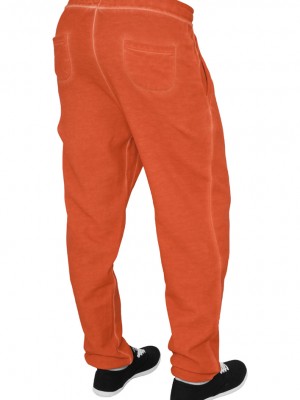 Дамски панталон за свободното време в оранжево Urban Classics Ladies Spray Dye Sweatpant
