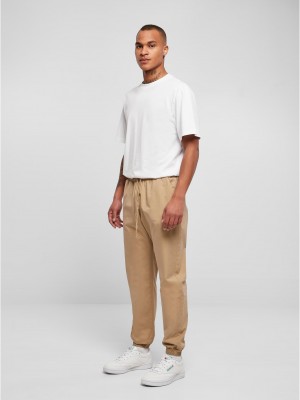 Мъжко долнище в бежов цвят Urban Classics Basic Pants Мъжко долнище в бежов цвят Urban Classics Basic Pants